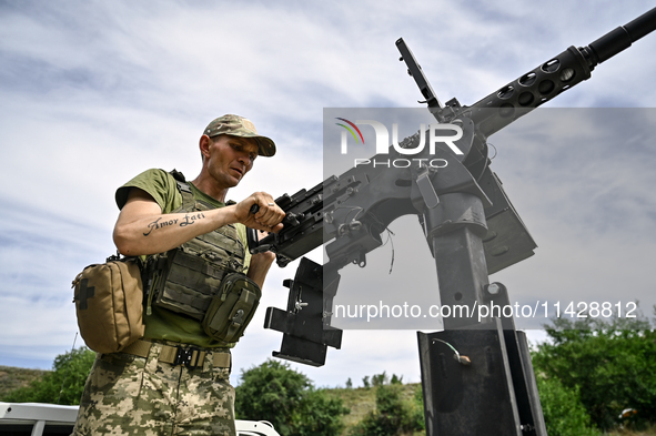 A fighter of the Separate Anti-Aircraft Machine Gun Battalion, who is providing air cover for the unmanned aerial vehicles and destroying ta...