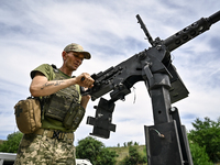 A fighter of the Separate Anti-Aircraft Machine Gun Battalion, who is providing air cover for the unmanned aerial vehicles and destroying ta...