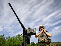 A fighter of the Separate Anti-Aircraft Machine Gun Battalion, who is providing air cover for the unmanned aerial vehicles and destroying ta...