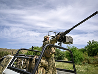 A fighter of the Separate Anti-Aircraft Machine Gun Battalion, who is providing air cover for the unmanned aerial vehicles and destroying ta...