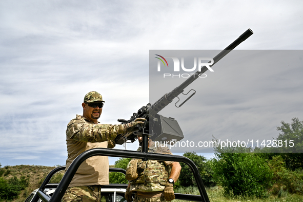 A fighter of the Separate Anti-Aircraft Machine Gun Battalion, who is providing air cover for the unmanned aerial vehicles and destroying ta...