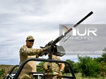 A fighter of the Separate Anti-Aircraft Machine Gun Battalion, who is providing air cover for the unmanned aerial vehicles and destroying ta...