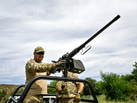 A fighter of the Separate Anti-Aircraft Machine Gun Battalion, who is providing air cover for the unmanned aerial vehicles and destroying ta...