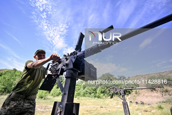 A fighter of the Separate Anti-Aircraft Machine Gun Battalion, who is providing air cover for the unmanned aerial vehicles and destroying ta...