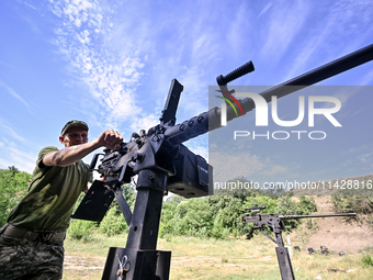 A fighter of the Separate Anti-Aircraft Machine Gun Battalion, who is providing air cover for the unmanned aerial vehicles and destroying ta...