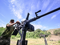 A fighter of the Separate Anti-Aircraft Machine Gun Battalion, who is providing air cover for the unmanned aerial vehicles and destroying ta...