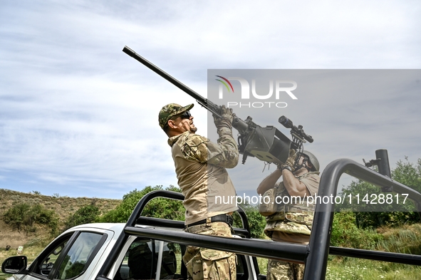 Fighters of the Separate Anti-Aircraft Machine Gun Battalion, who are providing air cover for unmanned aerial vehicles and destroying target...