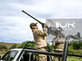 Fighters of the Separate Anti-Aircraft Machine Gun Battalion, who are providing air cover for unmanned aerial vehicles and destroying target...