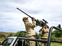 Fighters of the Separate Anti-Aircraft Machine Gun Battalion, who are providing air cover for unmanned aerial vehicles and destroying target...