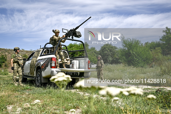 Fighters of the Separate Anti-Aircraft Machine Gun Battalion, who are providing air cover for unmanned aerial vehicles and destroying target...