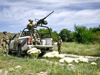 Fighters of the Separate Anti-Aircraft Machine Gun Battalion, who are providing air cover for unmanned aerial vehicles and destroying target...