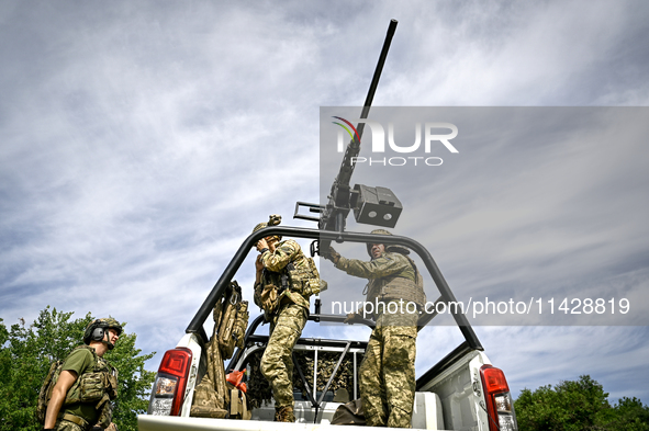 Fighters of the Separate Anti-Aircraft Machine Gun Battalion, who are providing air cover for unmanned aerial vehicles and destroying target...