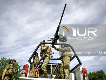 Fighters of the Separate Anti-Aircraft Machine Gun Battalion, who are providing air cover for unmanned aerial vehicles and destroying target...