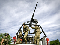 Fighters of the Separate Anti-Aircraft Machine Gun Battalion, who are providing air cover for unmanned aerial vehicles and destroying target...