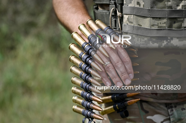 Bullets are being seen during the shooting practice with a Browning heavy machine gun by the soldiers of the Separate Anti-Aircraft Machine...