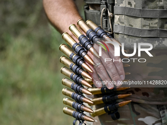 Bullets are being seen during the shooting practice with a Browning heavy machine gun by the soldiers of the Separate Anti-Aircraft Machine...