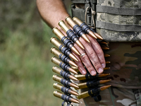 Bullets are being seen during the shooting practice with a Browning heavy machine gun by the soldiers of the Separate Anti-Aircraft Machine...