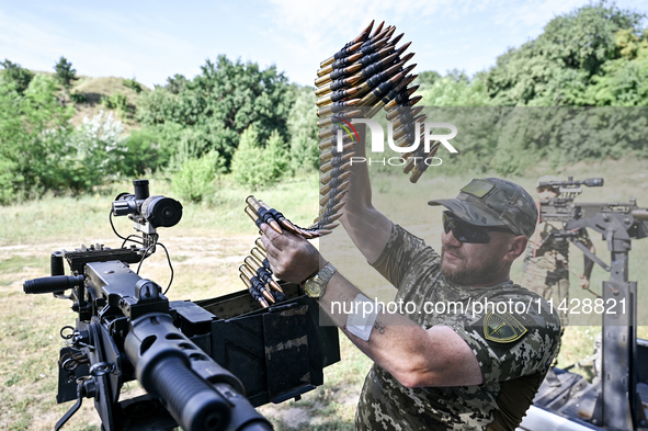 A fighter of the Separate Anti-Aircraft Machine Gun Battalion, who is providing air cover for the unmanned aerial vehicles and destroying ta...