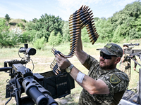 A fighter of the Separate Anti-Aircraft Machine Gun Battalion, who is providing air cover for the unmanned aerial vehicles and destroying ta...