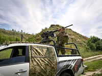 A fighter of the Separate Anti-Aircraft Machine Gun Battalion, who is providing air cover for the unmanned aerial vehicles and destroying ta...