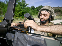 A fighter of the Separate Anti-Aircraft Machine Gun Battalion, who is providing air cover for the unmanned aerial vehicles and destroying ta...