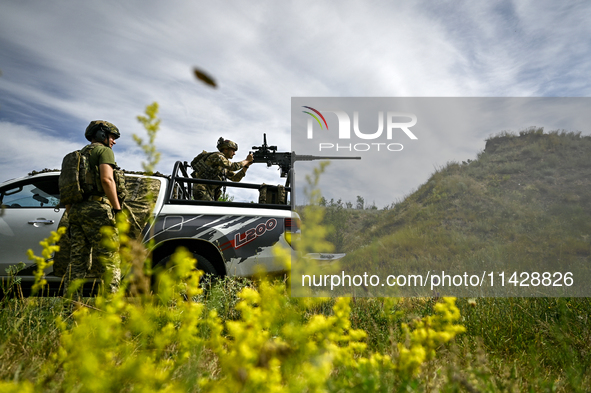 Fighters of the Separate Anti-Aircraft Machine Gun Battalion, who are providing air cover for unmanned aerial vehicles and destroying target...