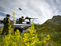 Fighters of the Separate Anti-Aircraft Machine Gun Battalion, who are providing air cover for unmanned aerial vehicles and destroying target...