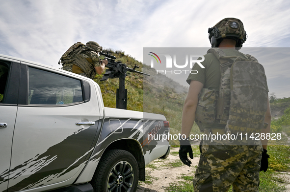 Fighters of the Separate Anti-Aircraft Machine Gun Battalion, who are providing air cover for unmanned aerial vehicles and destroying target...