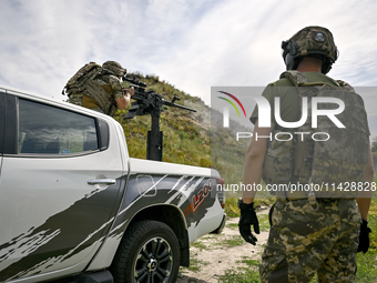 Fighters of the Separate Anti-Aircraft Machine Gun Battalion, who are providing air cover for unmanned aerial vehicles and destroying target...