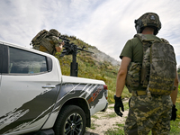 Fighters of the Separate Anti-Aircraft Machine Gun Battalion, who are providing air cover for unmanned aerial vehicles and destroying target...