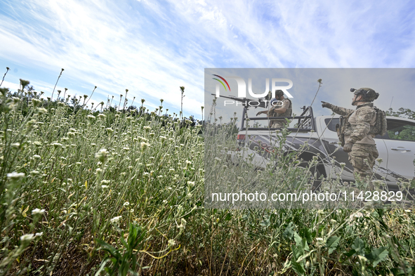 Fighters of the Separate Anti-Aircraft Machine Gun Battalion, who are providing air cover for unmanned aerial vehicles and destroying target...