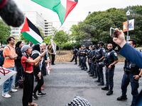 Pro-Palestinian activists demonstrate near the Watergate hotel ahead of the visit of Israeli Prime Minister Benjamin Netanyahu in Washington...