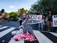 Pro-Palestinian activists demonstrate near the Watergate hotel ahead of the visit of Israeli Prime Minister Benjamin Netanyahu in Washington...