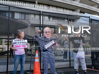 Pro-Palestinian activists demonstrate near the Watergate hotel ahead of the visit of Israeli Prime Minister Benjamin Netanyahu in Washington...