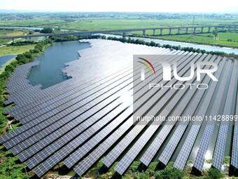 A 20MW distributed photovoltaic power station of the fishery-solar hybrid project is being shown in Xiage town of Chaohu city, in Chaohu, Ch...