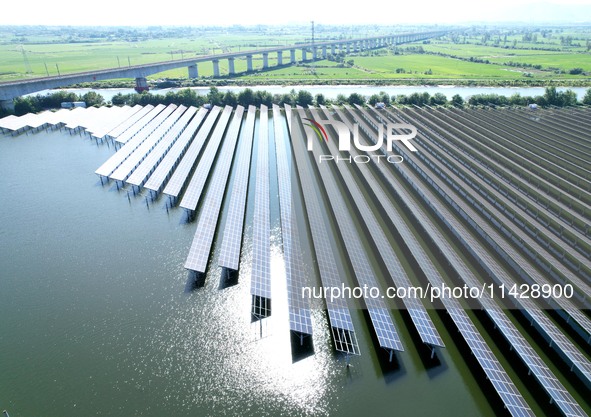 A 20MW distributed photovoltaic power station of the fishery-solar hybrid project is being shown in Xiage town of Chaohu city, in Chaohu, Ch...