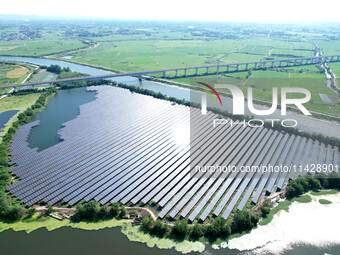 A 20MW distributed photovoltaic power station of the fishery-solar hybrid project is being shown in Xiage town of Chaohu city, in Chaohu, Ch...