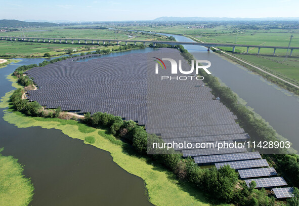 A 20MW distributed photovoltaic power station of the fishery-solar hybrid project is being shown in Xiage town of Chaohu city, in Chaohu, Ch...