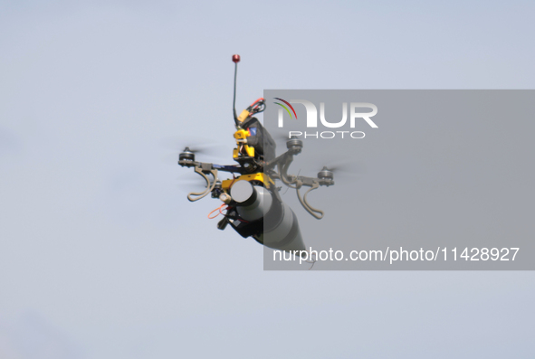 A kamikaze drone with a warhead is performing a demonstration flight during the 2nd Drone Racing Tournament by the Federation of Military Te...