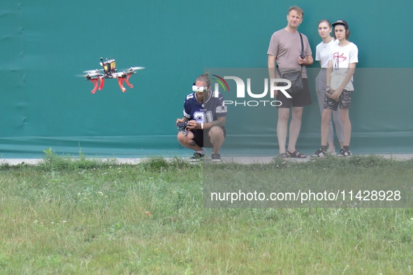 A participant in the 2nd Drone Racing Tournament by the Federation of Military Technological Sports of Ukraine is flying a drone in Bilohoro...