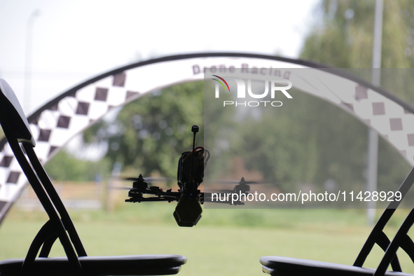 A drone is flying during the 2nd Drone Racing Tournament by the Federation of Military Technological Sports of Ukraine in Bilohorodka, Kyiv...