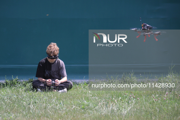 A participant in the 2nd Drone Racing Tournament by the Federation of Military Technological Sports of Ukraine is flying a drone in Bilohoro...