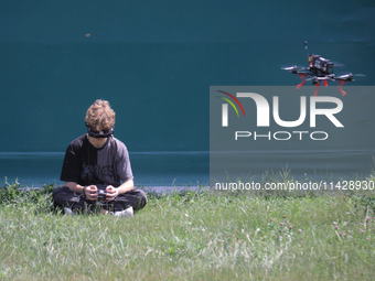 A participant in the 2nd Drone Racing Tournament by the Federation of Military Technological Sports of Ukraine is flying a drone in Bilohoro...