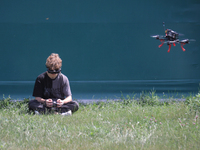 A participant in the 2nd Drone Racing Tournament by the Federation of Military Technological Sports of Ukraine is flying a drone in Bilohoro...