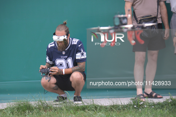 A participant in the 2nd Drone Racing Tournament by the Federation of Military Technological Sports of Ukraine is flying a drone in Bilohoro...