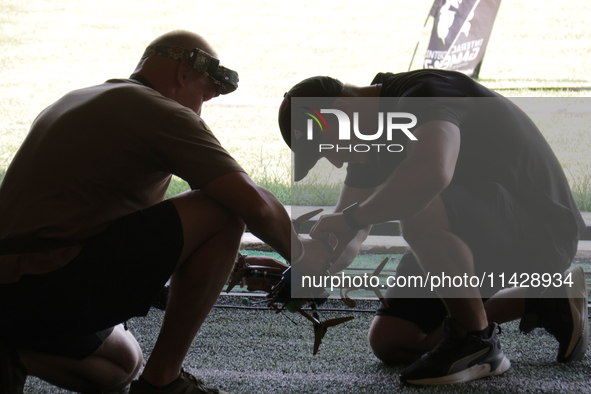 A participant in the 2nd Drone Racing Tournament by the Federation of Military Technological Sports of Ukraine is flying a drone in Bilohoro...