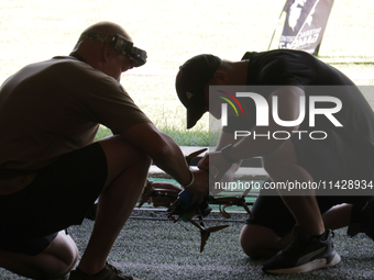 A participant in the 2nd Drone Racing Tournament by the Federation of Military Technological Sports of Ukraine is flying a drone in Bilohoro...