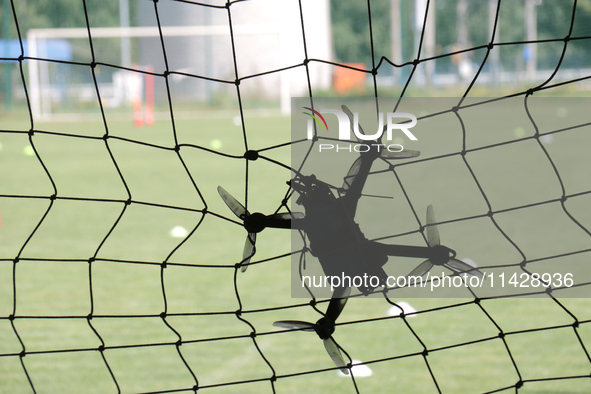 A drone is flying at the finish line during the 2nd Drone Racing Tournament by the Federation of Military Technological Sports of Ukraine in...