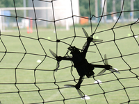 A drone is flying at the finish line during the 2nd Drone Racing Tournament by the Federation of Military Technological Sports of Ukraine in...