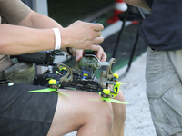 A participant in the 2nd Drone Racing Tournament by the Federation of Military Technological Sports of Ukraine is attaching a grenade to the...